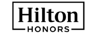A black image with a small white dot at the bottom center, and a tiny, faint gradient; unclear subject, mostly empty space. logo on footer section.